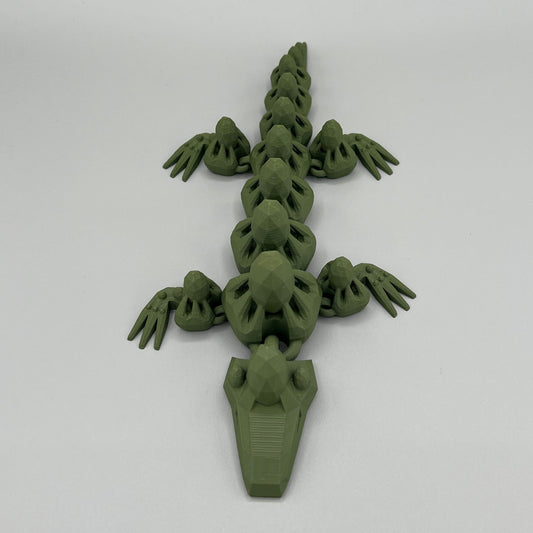 Heady Prints 3D printed green articulated gem lizard, side view