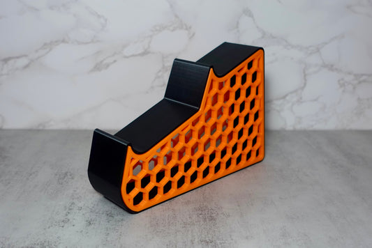Heady Prints 3D printed orange and black honeycomb gaming console holder, desk accessory