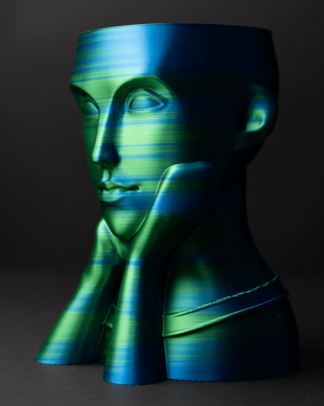 Heady Prints 3D printed black and green face vase, three quarter view