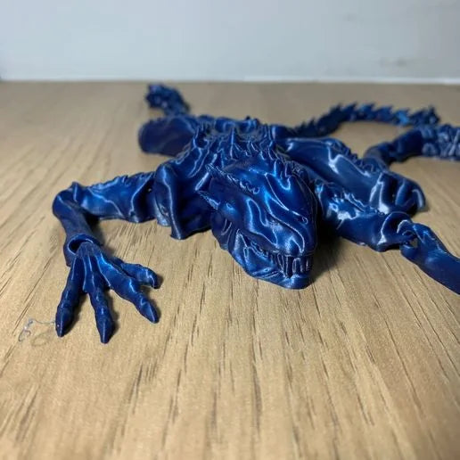 Heady Prints 3D printed blue articulated alien, front, three quarter view