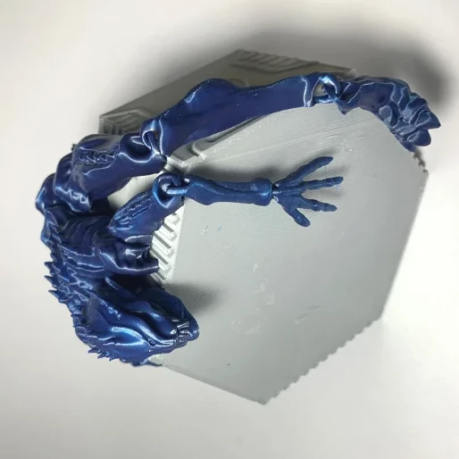 Heady Prints 3D printed blue articulated alien, side view