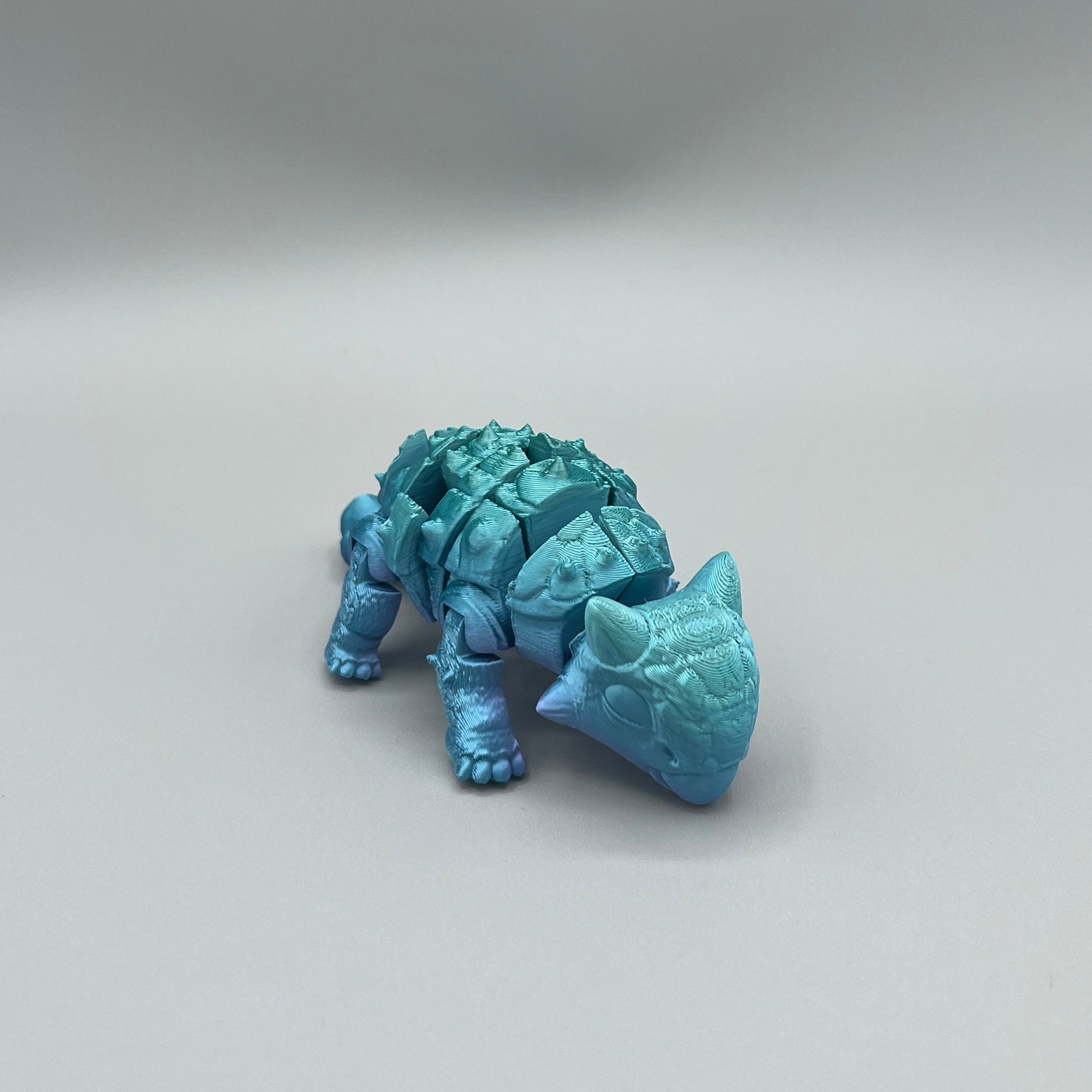 Heady Prints 3D printed blue articulated ankylosaurus, front view