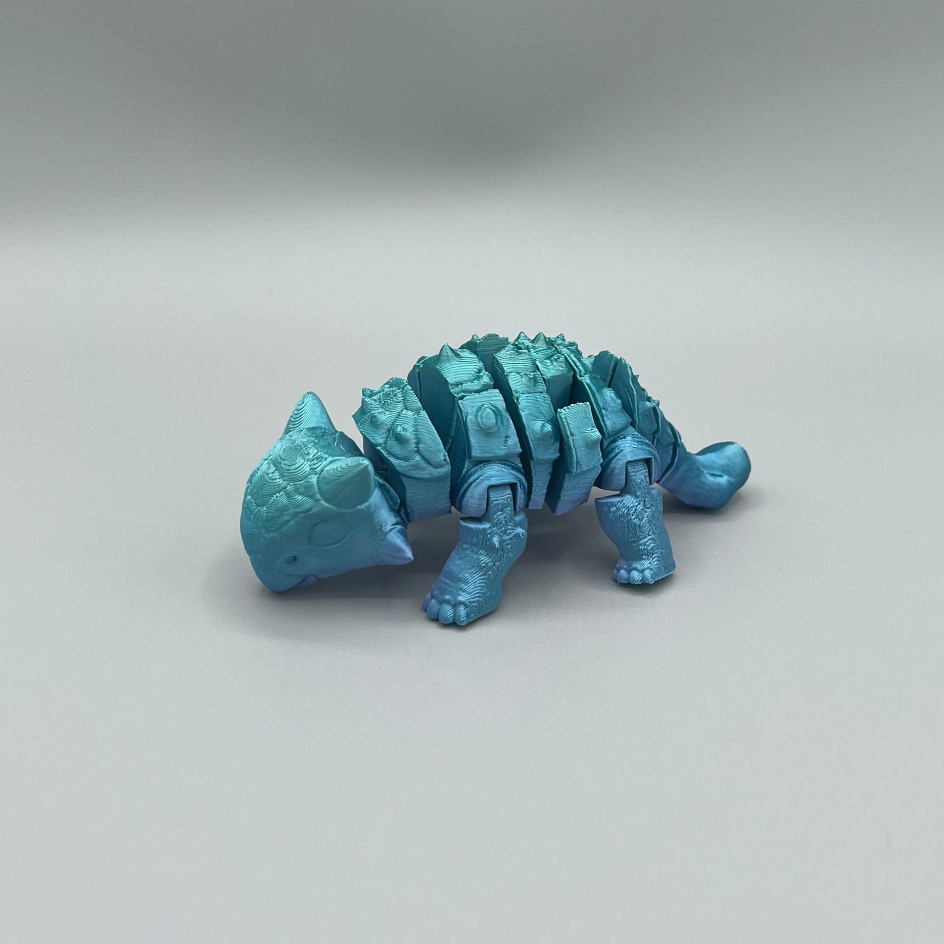 Heady Prints 3D printed blue articulated ankylosaurus, promo