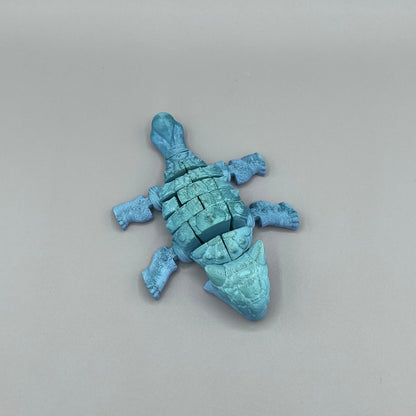 Heady Prints 3D printed blue articulated ankylosaurus, side view