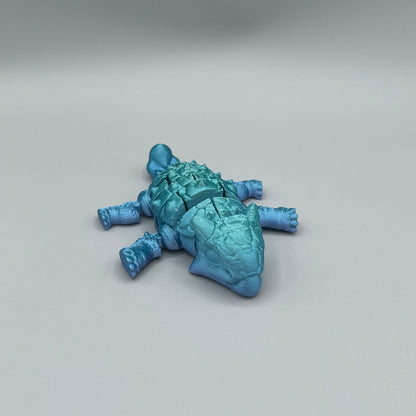 Heady Prints 3D printed blue articulated ankylosaurus, three quarter view