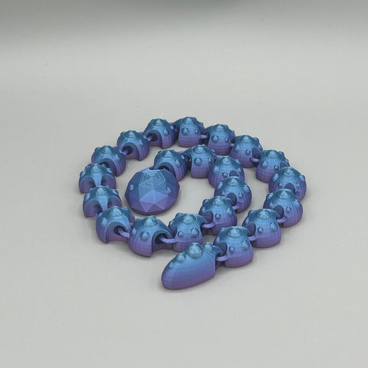 Heady Prints 3D printed blue articulated gem snake, coiled view