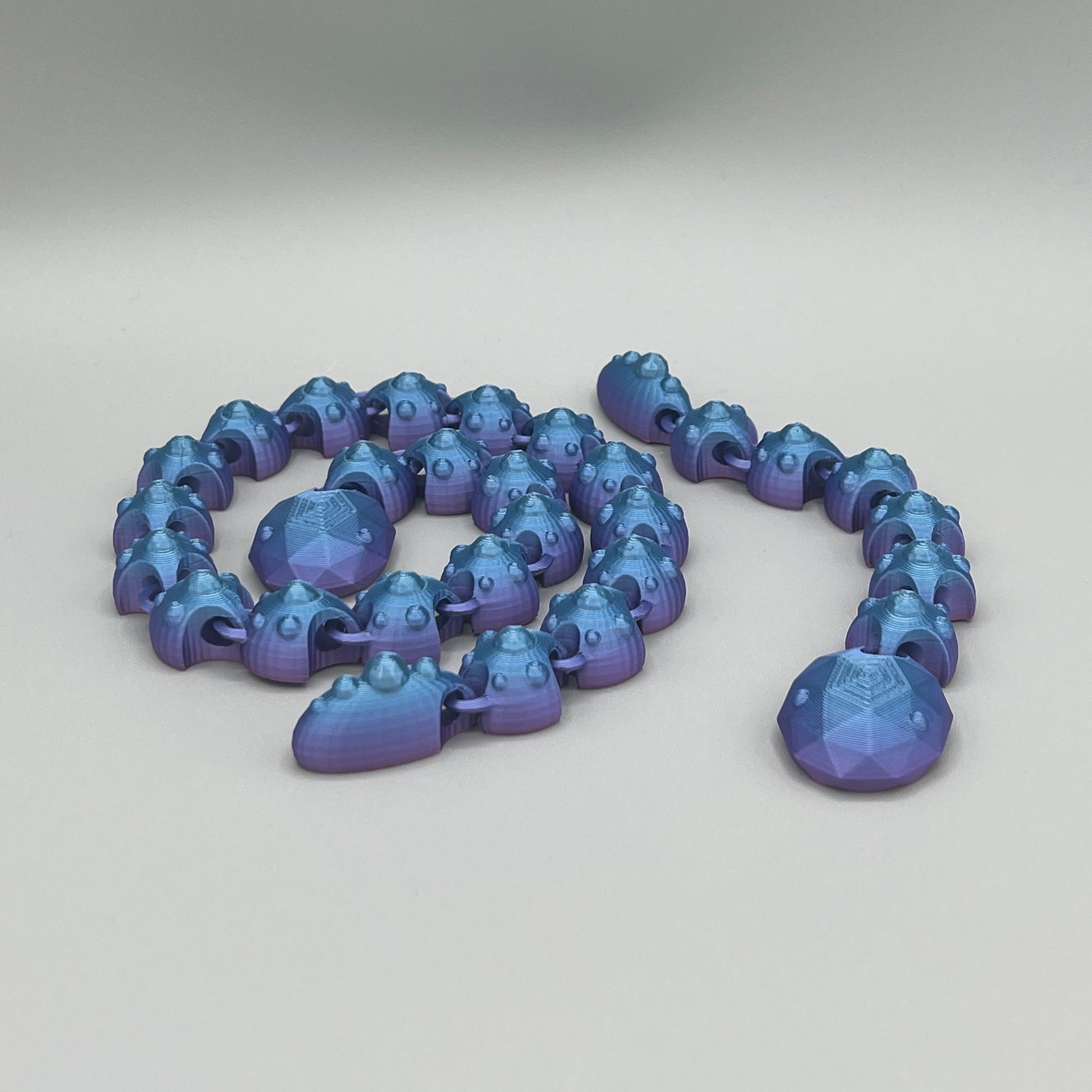 Heady Prints 3D printed multicolor articulated gem snake, promo