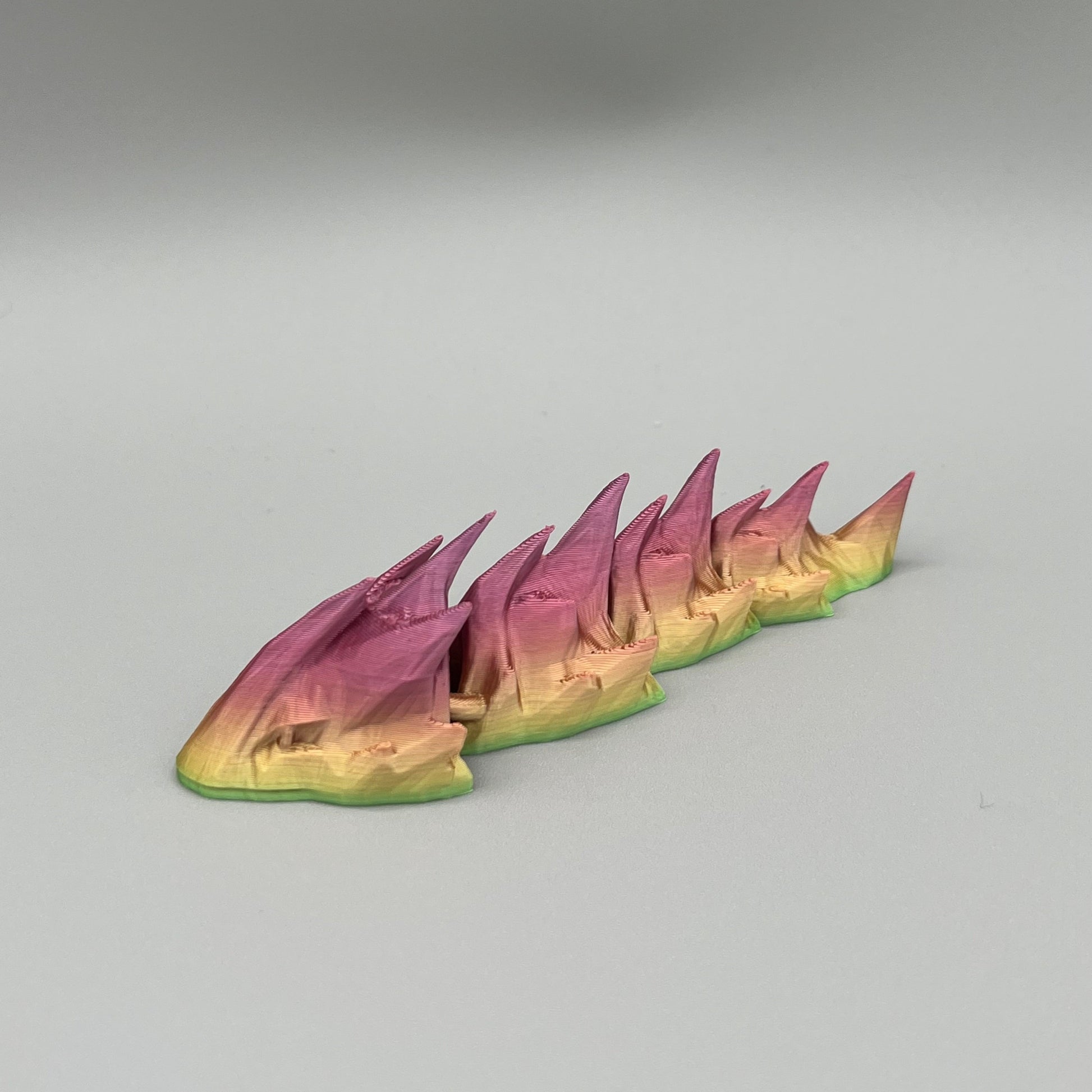 Heady Prints 3D printed multicolor articulated sea serpent, front view