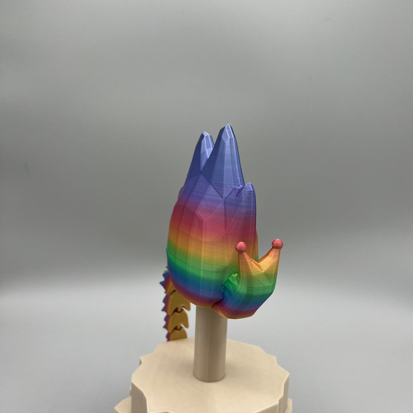 Heady Prints 3D printed multicolor articulated spike snail, side view