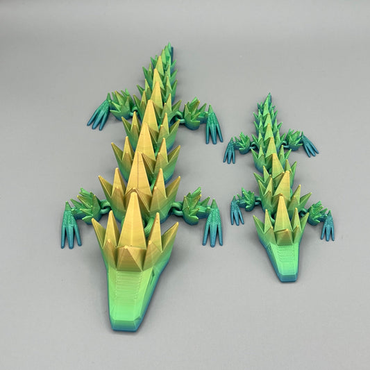Heady Prints 3D printed green and yellow articulated spikey lizard, group shot