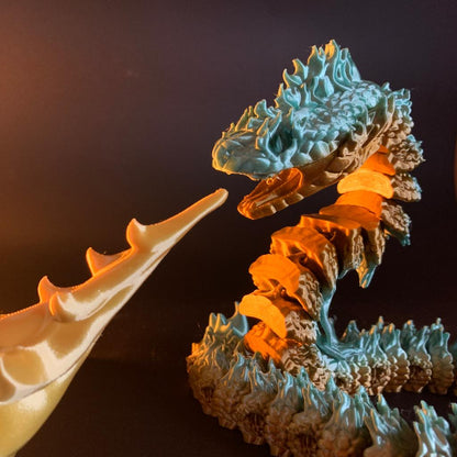 Heady Prints 3D printed teal and orange Boitata articulated snake figurine, close-up detail
