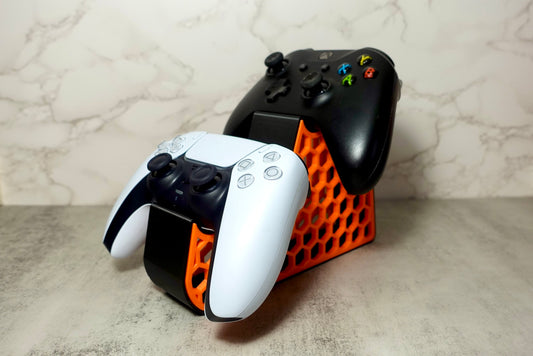 Heady Prints 3D printed orange and black console holder with gaming controllers, desk companion