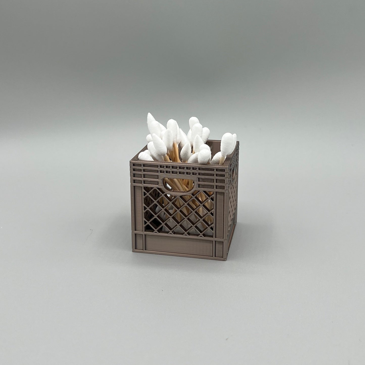 Heady Prints 3D printed brown crate desk organizer, filled, cotton swabs, angled view