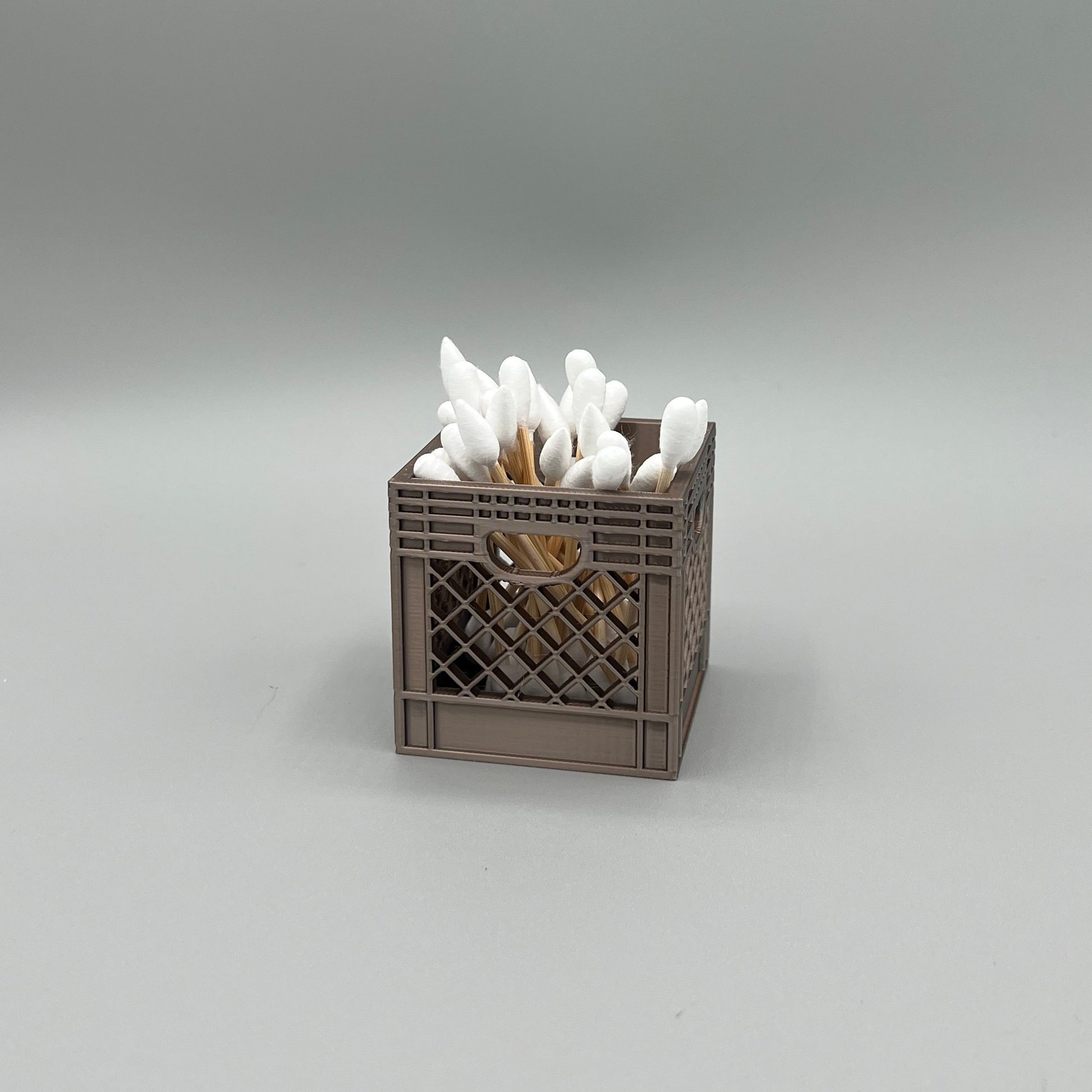 Heady Prints 3D printed brown crate desk organizer, filled, cotton swabs, angled view