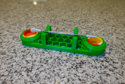 Heady Prints 3D printed green dab tool rest with multicolor ends, session accessory