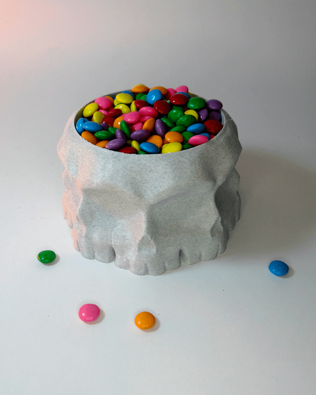 Heady Prints 3D printed white geometric elephant bowl with colorful candy, lifestyle shot