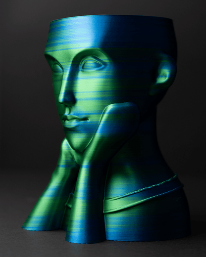 Heady Prints 3D printed black and green face vase, three quarter view