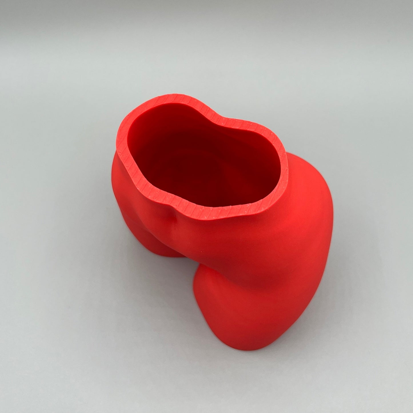 Heady Prints 3D printed red female body vase, side view