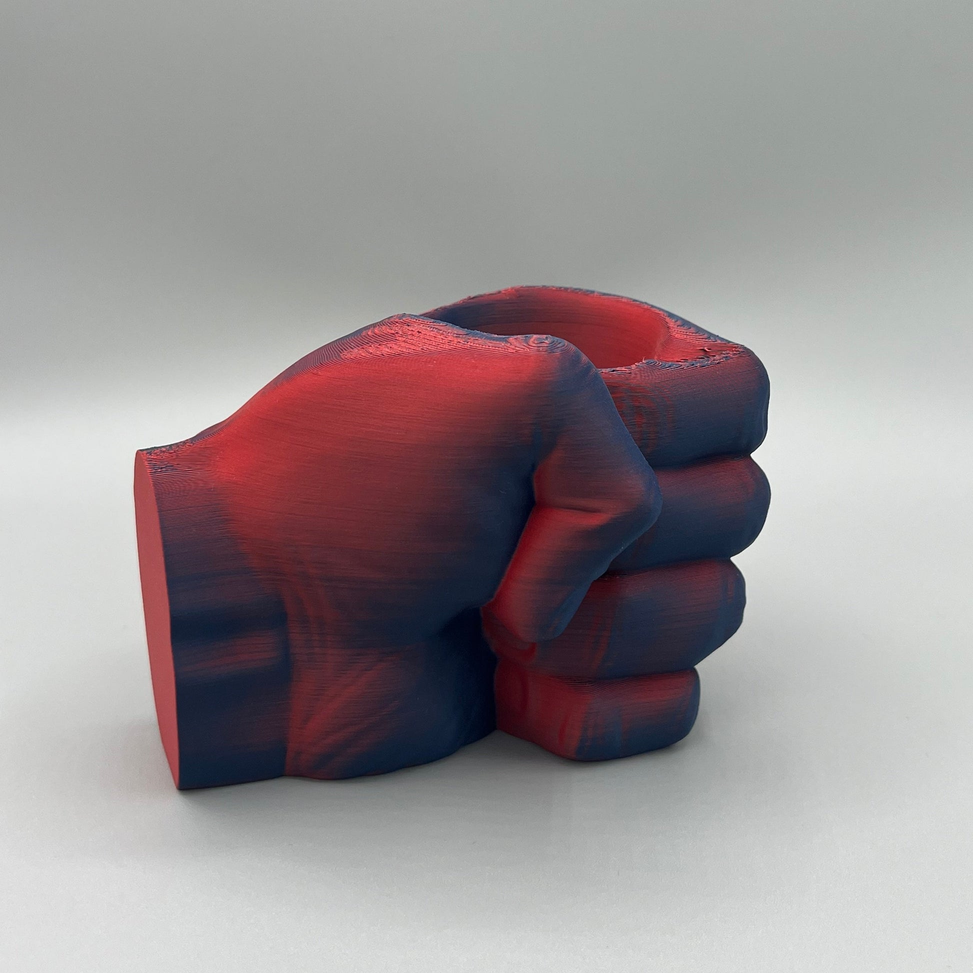Heady Prints 3D printed red and blue fist pencil holder, front view