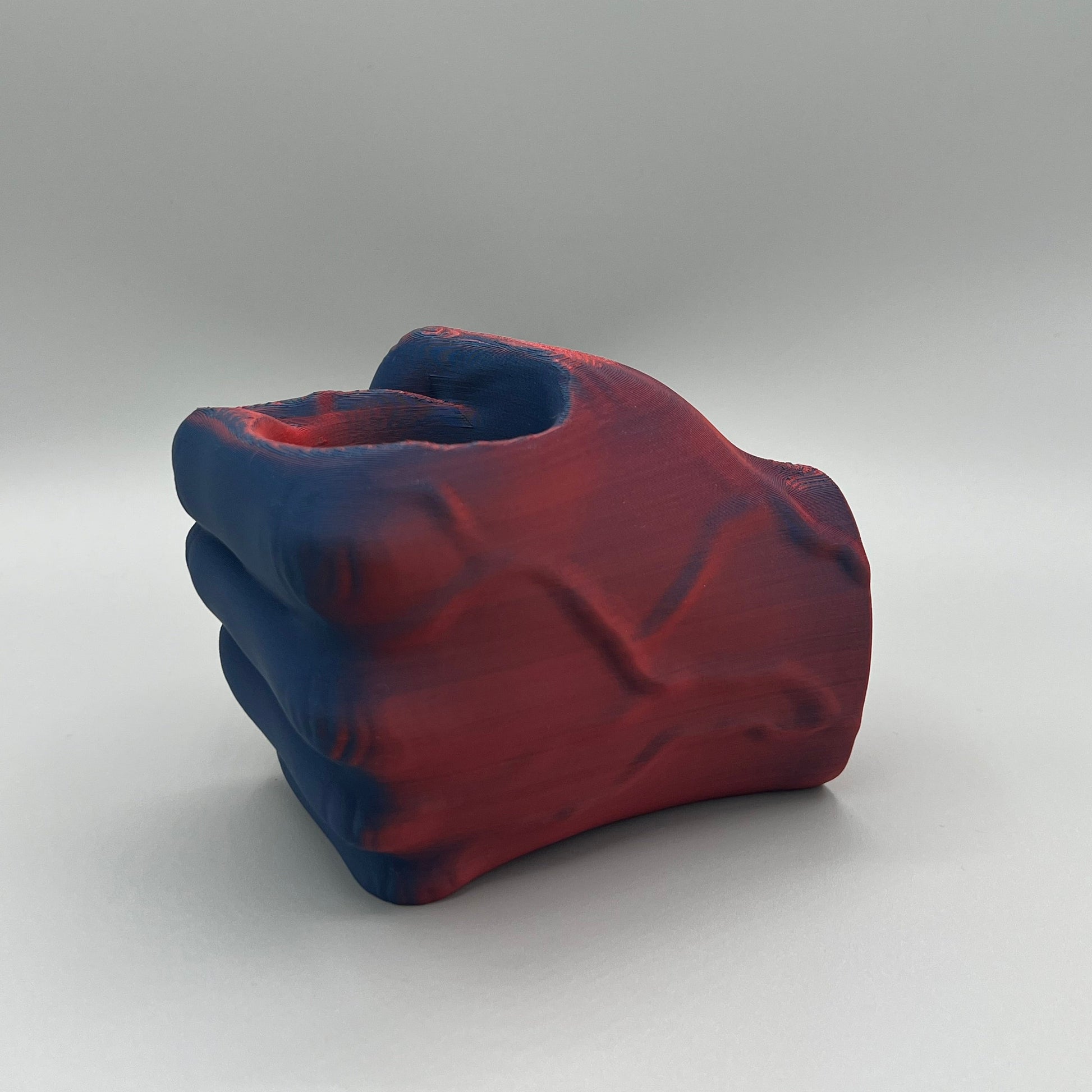 Heady Prints 3D printed red and blue fist pencil holder, side view