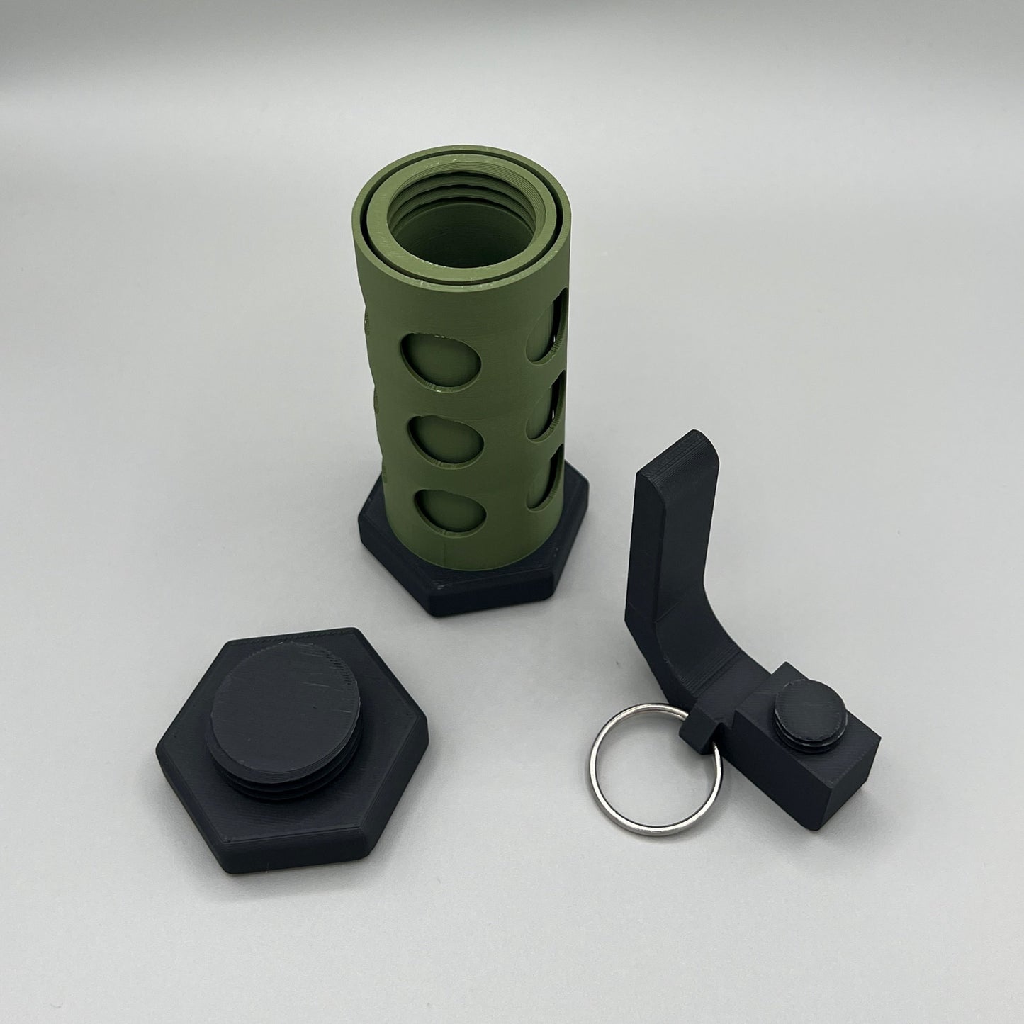 Heady Prints 3D printed green and black flashbang stash container, parts view
