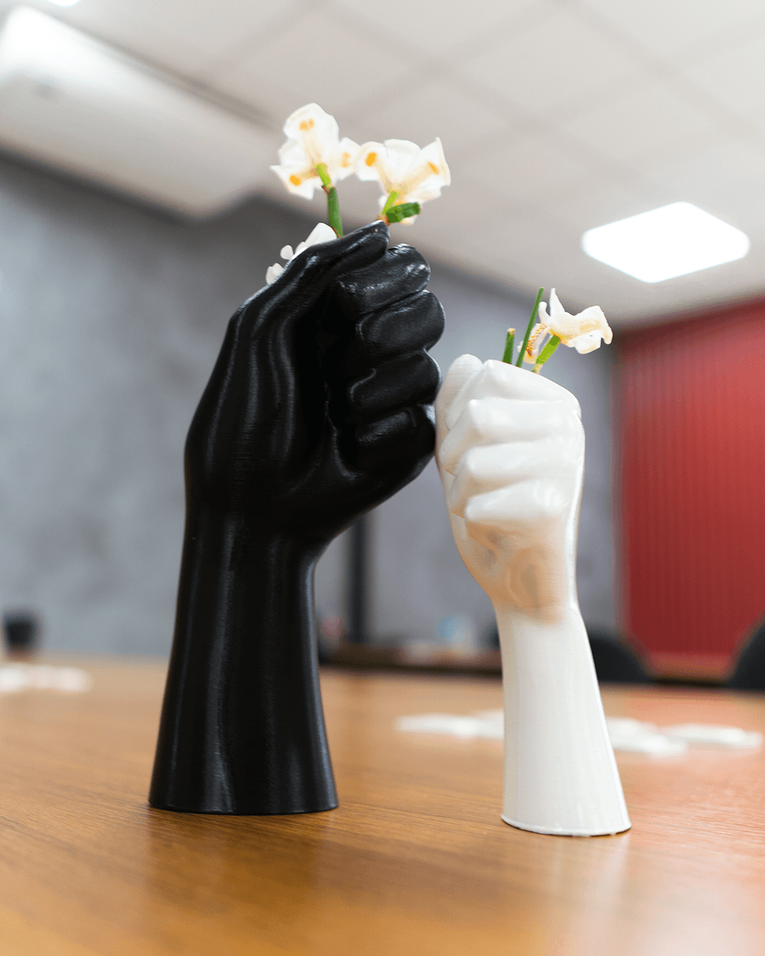 Heady Prints 3D printed black hand-shaped flower vase lifestyle shot, home accent decor