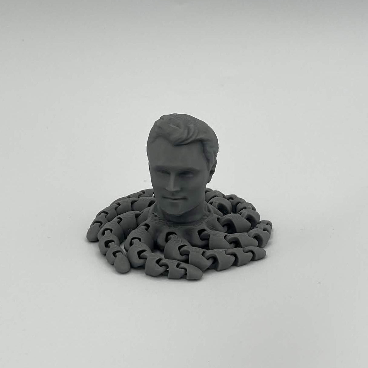 Heady Prints 3D printed gray Kirktopus articulated octopus figure, front view