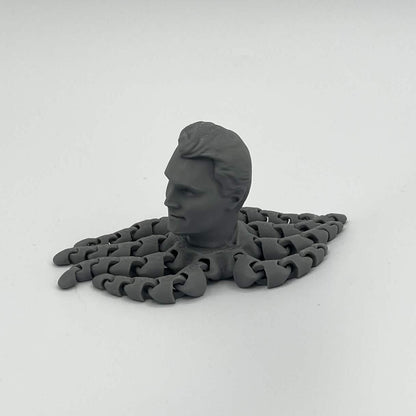 Heady Prints 3D printed gray Kirktopus articulated octopus figure, side view