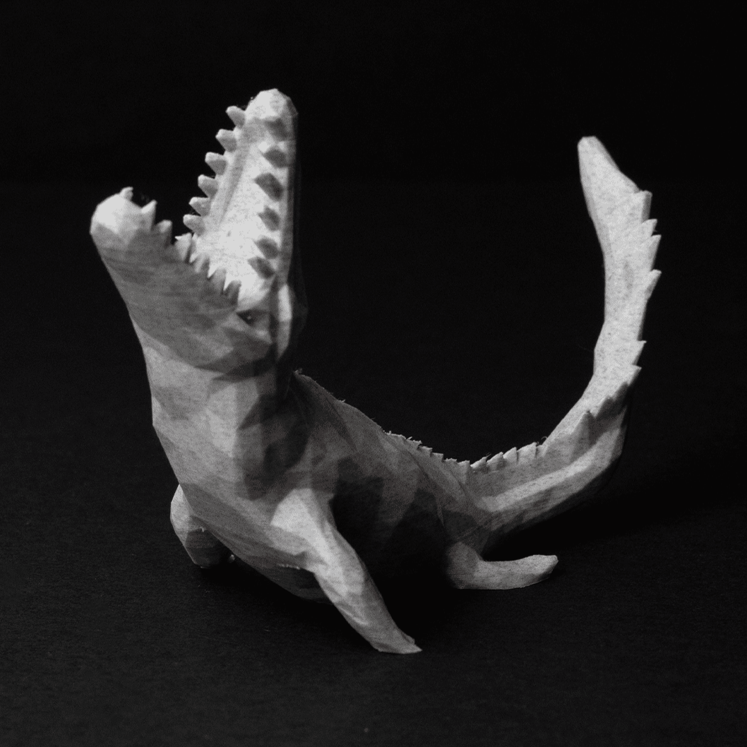Heady Prints 3D printed low poly raptor figurine, angled view