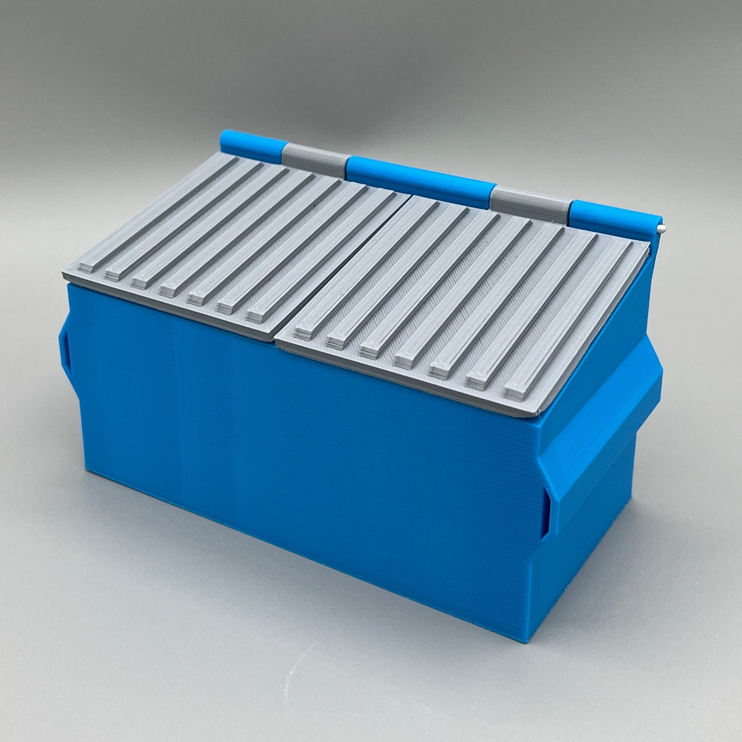 Heady Prints 3D printed blue split compartment mini dumpster, angled view