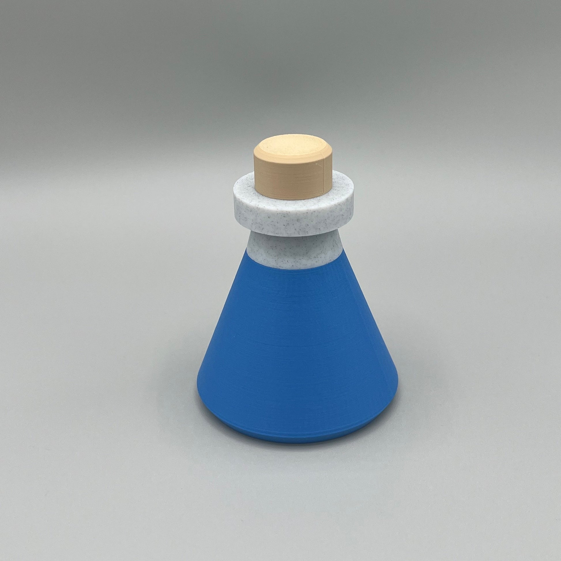 Heady Prints 3D printed blue potion bottle, angled view