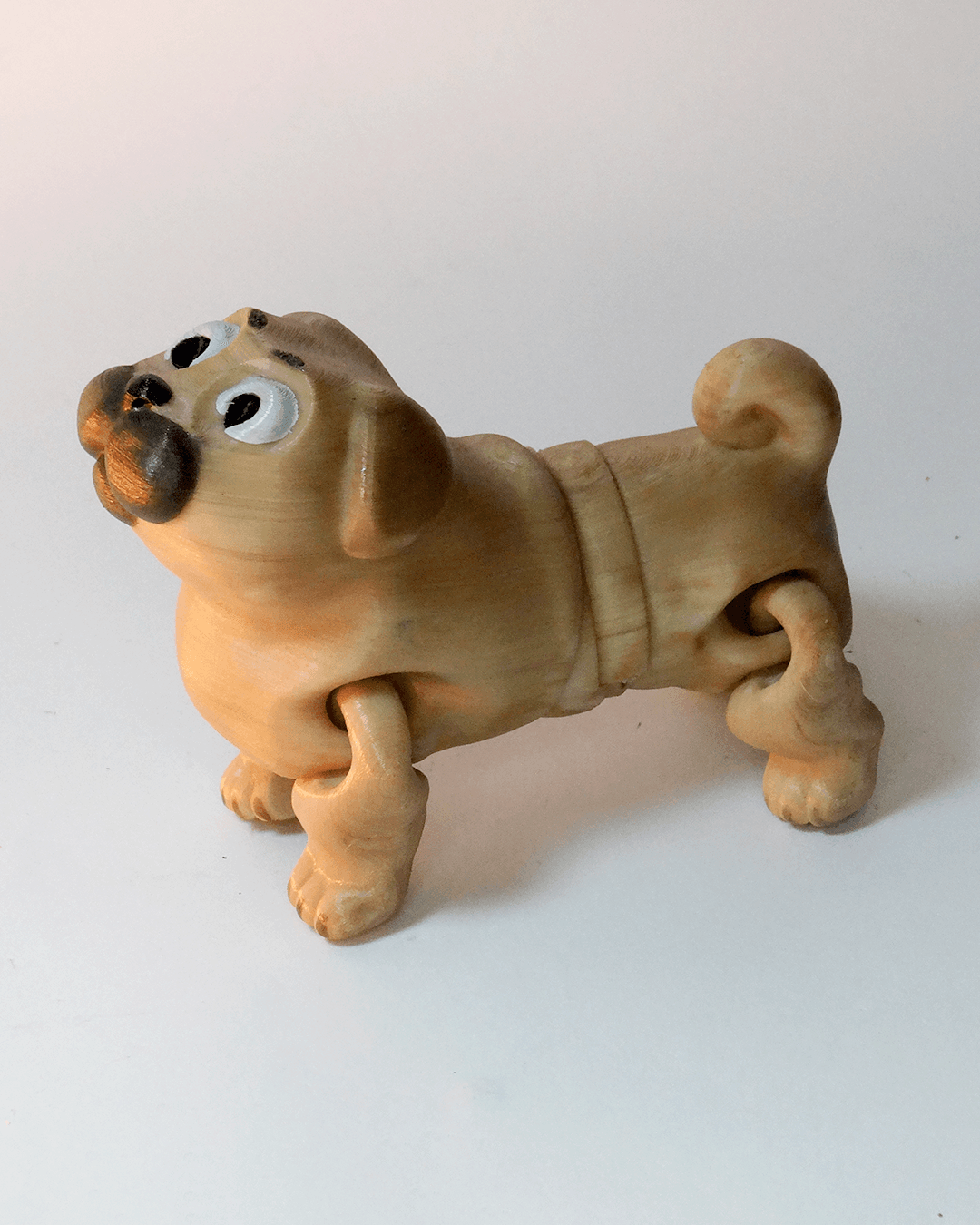 Heady Prints 3D printed tan pug figurine, side view
