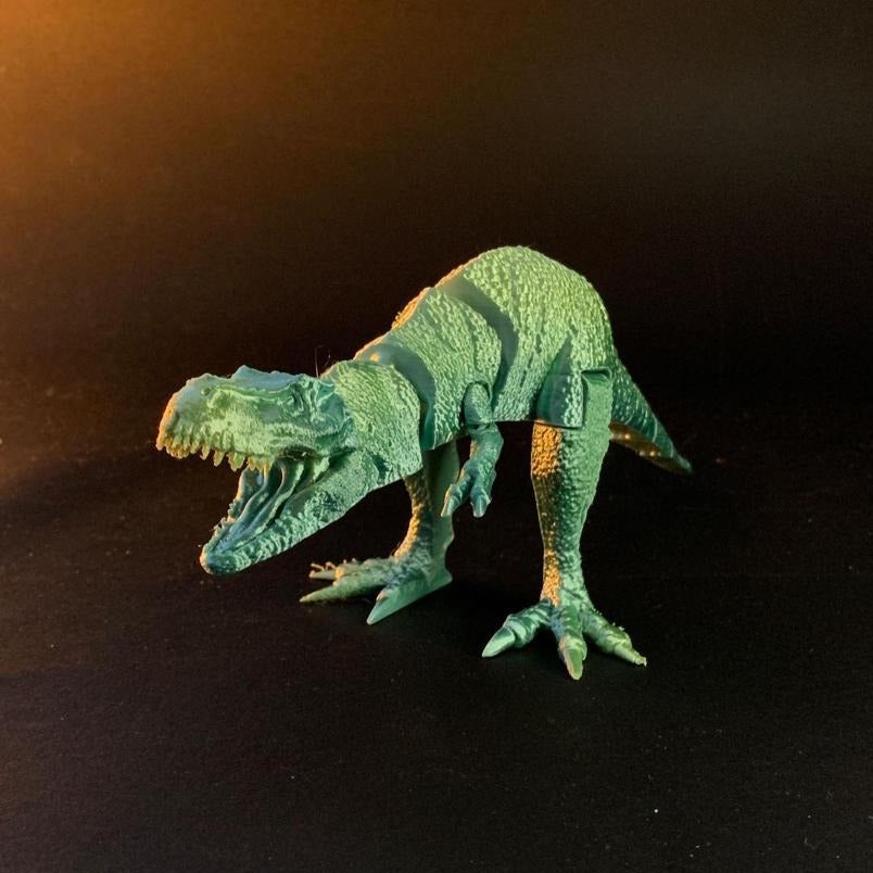 Heady Prints 3D printed gold skeletal dragon figurine lifestyle shot, desk companion