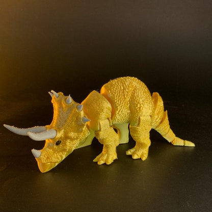 Heady Prints 3D printed orange articulated triceratops figurine, front view