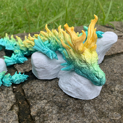Heady Prints 3D printed Zandhros teal and yellow dragon figurine, outdoor top view