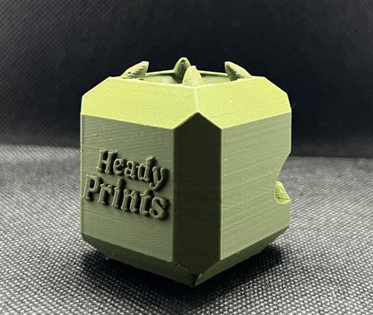 Heady Prints 3D printed green heady cube, label close-up